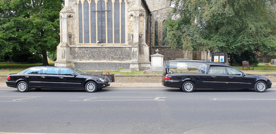 Black vehicles outside St. Mary’s Church, Mildenhall